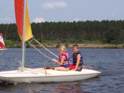 Young kids learning to sail